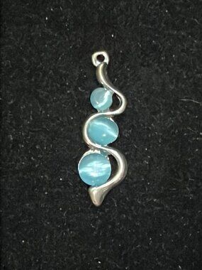 3 Satin Blue Beads with Silver Tone Curves Pendant